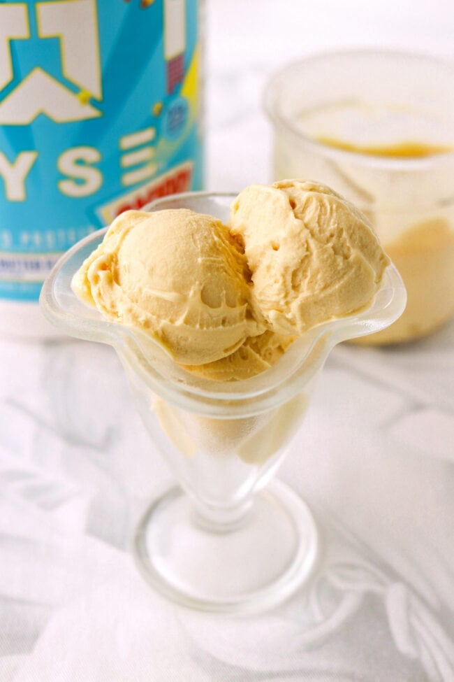 Creamy peanut butter protein ice cream scoops in a glass dish.