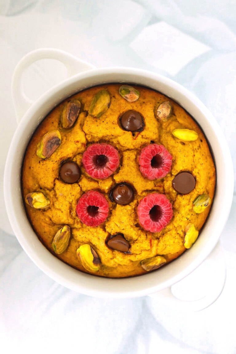 Golden Milk Baked Oats in a white ramekin with handles.