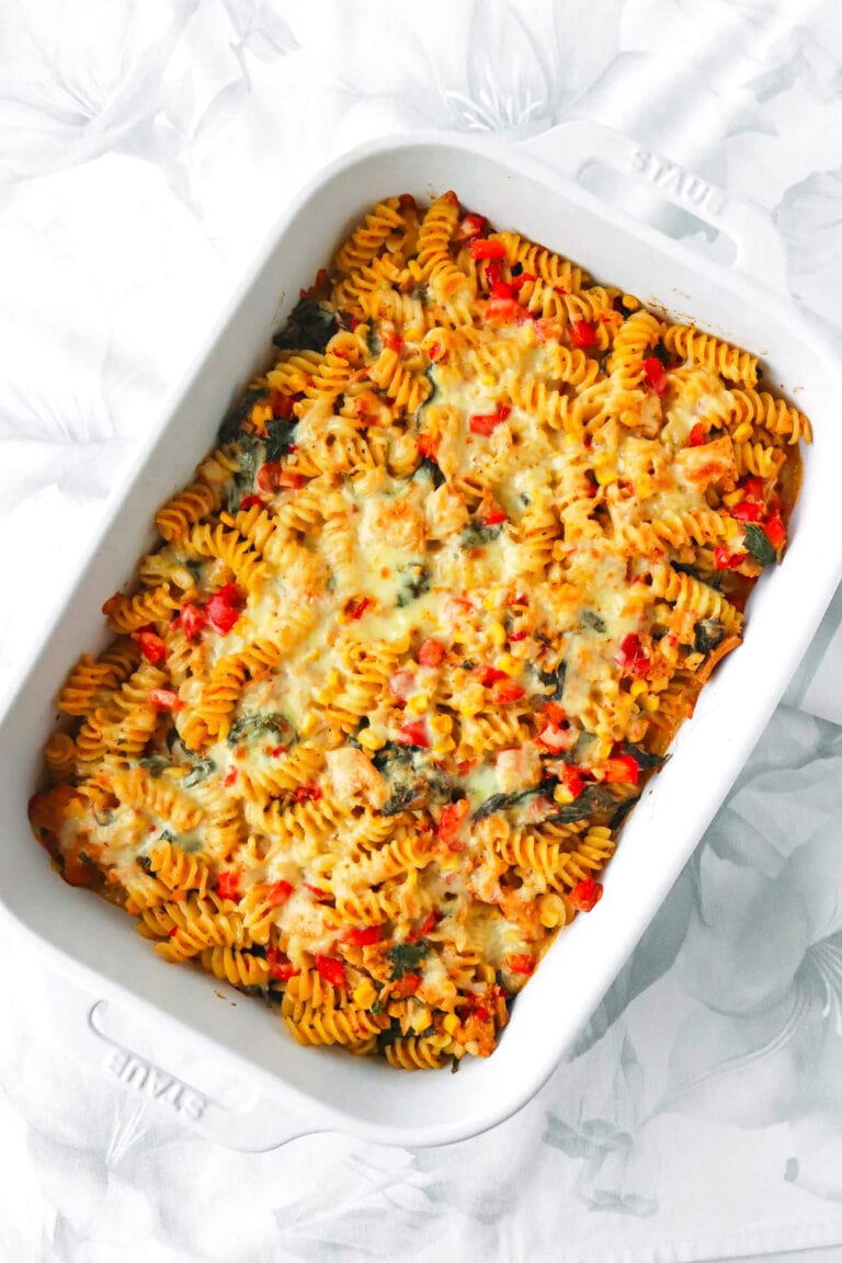 Top view of spicy Thai red curry tuna pasta bake in a baking dish.