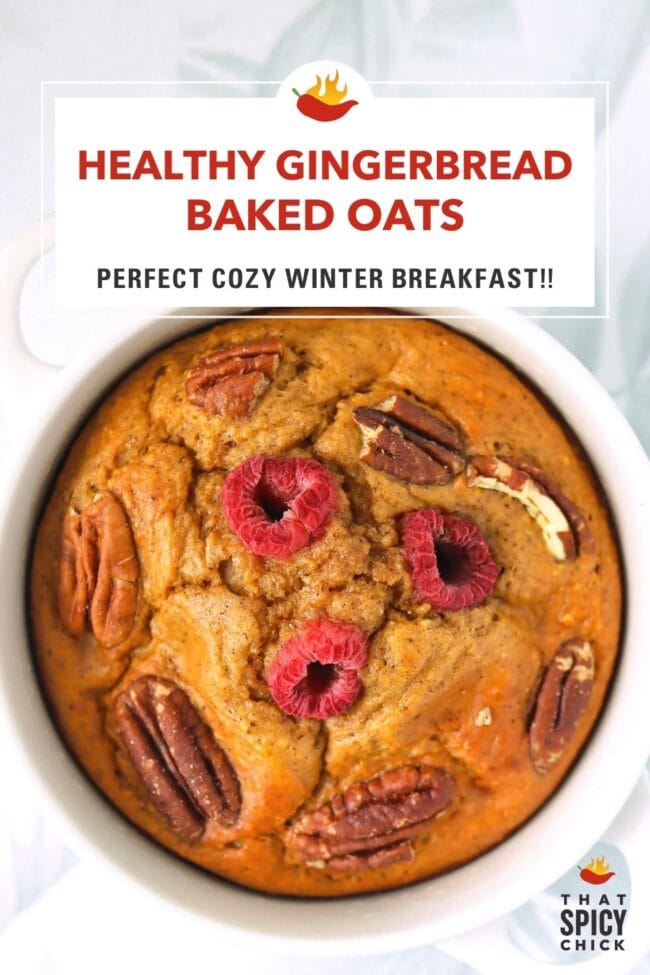 Closeup of spiced baked oats in a white ramekin topped with raspberries and pecans. Text overlay "Healthy Gingerbread Baked Oats", "Perfect Cozy Winter Breakfast!" and "That Spicy Chick".