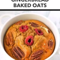 Warm spiced baked oats in a white ramekin topped with raspberries and pecans. Text overlay "Easy Winter Breakfast!", "Gingerbread Baked Oats", and "That Spicy Chick".