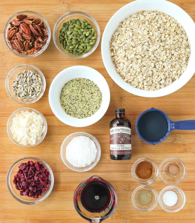 Labeled ingredients for Pecan Pie Granola on a wood board.