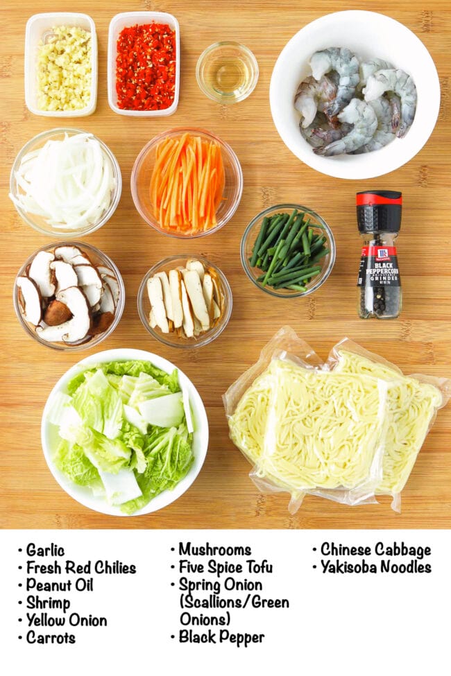 Labeled ingredients for Shrimp Yakisoba with Tofu on a wood board.