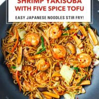 Wok with stir-fried noodles with shrimp, vegetables and sliced tofu. Text overlay "Shrimp Yakisoba with Five Spice Tofu", "Easy Japanese Noodles Stir-fry", and "That Spicy Chick".