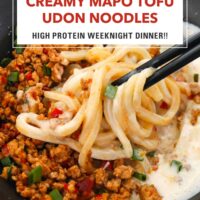 Chopsticks noodle pull from bowl with Sichuan style ground pork, noodles, and silken tofu sauce. Text overlay "Creamy Mapo Tofu Udon Noodles", "High Protein Weeknight Dinner" and "That Spicy Chick".