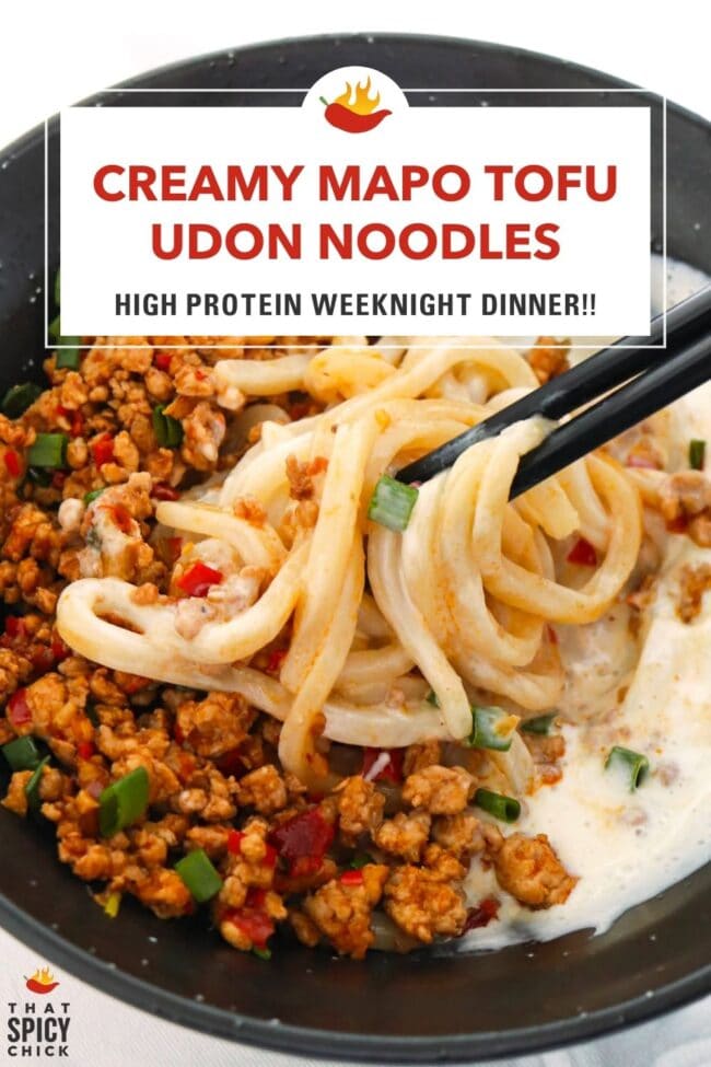 Chopsticks noodle pull from bowl with Sichuan style ground pork, noodles, and silken tofu sauce. Text overlay "Creamy Mapo Tofu Udon Noodles", "High Protein Weeknight Dinner" and "That Spicy Chick".