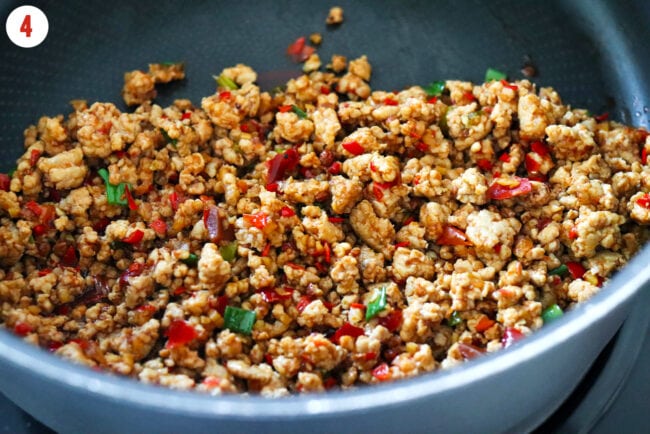 Sichuan mapo-style pork stir-fry in a skillet.