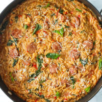 Closeup top view of pan with spicy Italian sausage orzo?