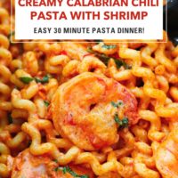 Calabrian chili pasta and shrimp in a nonstick pan. Text overlay "Creamy Calabrian Chili Pasta with Shrimp" and "Easy 30 MinutePasta Dinner!"