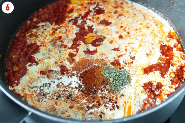 Added cream and seasonings to pan with sautéed tomato and calabrian chili paste mixture.