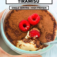 Hand holding a small round dish with cottage cheese tiramisu and a spoon. Text overlay "Cottage Cheese Tiramisu", "Single Serving | High Protein", and "That Spicy Chick".
