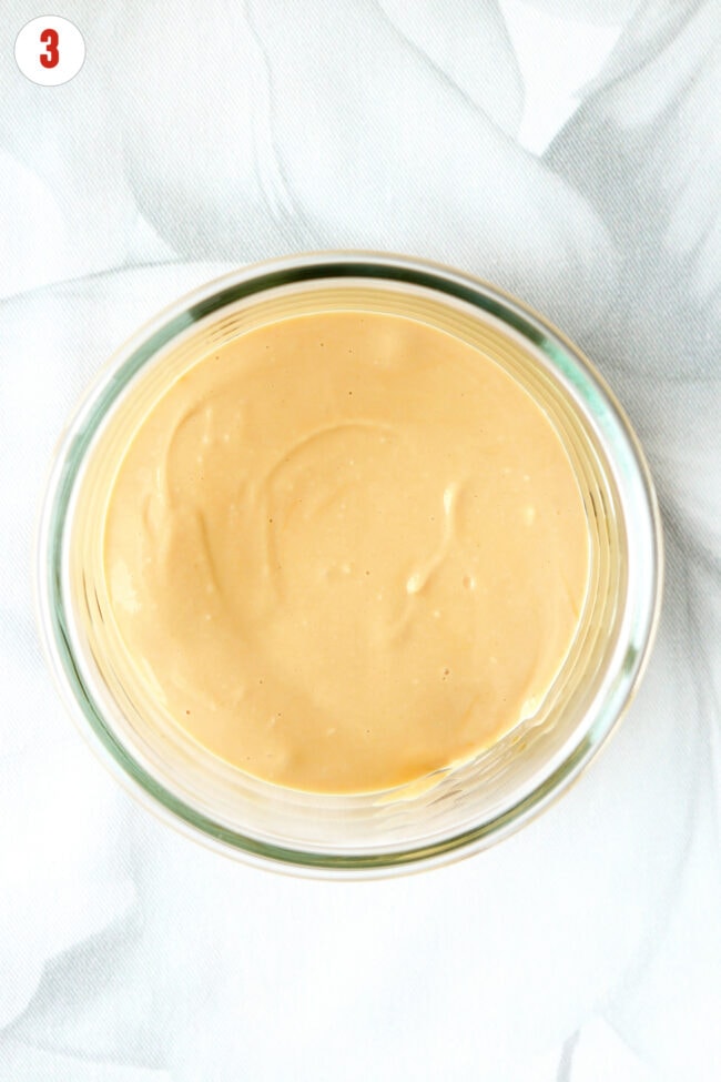 Small round dish with blended cottage cheese and dulce de leche mixture.