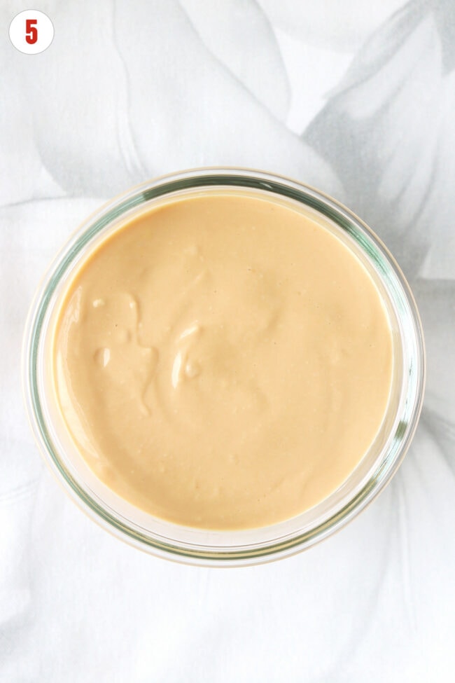 Small round dish with top layer of blended cottage cheese and dulce de leche mixture.