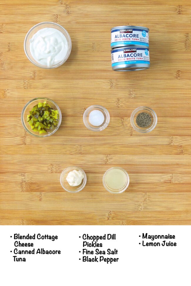 Labeled Cottage Cheese Tuna Salad ingredients on wood board.