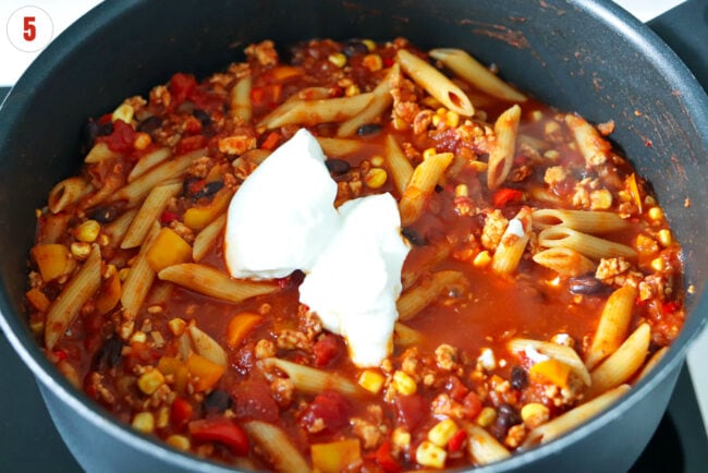 Blended cottage cheese in a pan with chicken taco pasta.