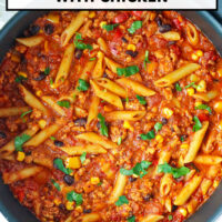 Pan with chicken taco pasta with cottage cheese topped with cilantro. Text overlay "High Protein Taco Pasta with Chicken" and "That Spicy Chick".