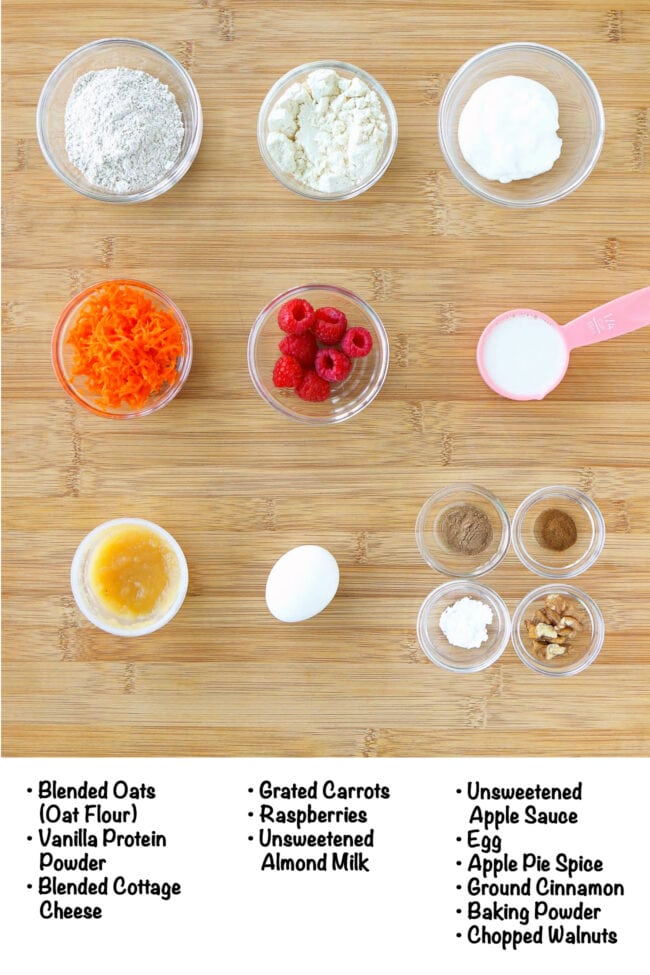 Labeled ingredients for carrot cake protein pancake with cottage cheese on a wood board.