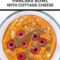 Carrot cake pancake in a round glass meal prep container topped with chopped walnuts, raspberries, pecan butter and maple syrup. Text overlay "Meal Prep Breakfast!". "Carrot Cake Protein Pancake Bowl with Cottage Cheese".