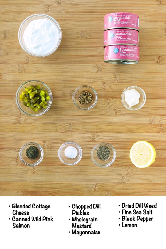 Labeled Cottage Cheese Salmon Salad ingredients on wood board.