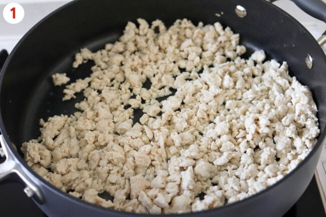 Cooked ground chicken in a skillet.