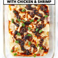 Dumpling lasagna in a glass dish topped with chili crisp and spring onion. Text overlay "Dumpling Lasagna with Chicken & Shrimp" and "That Spicy Chick".