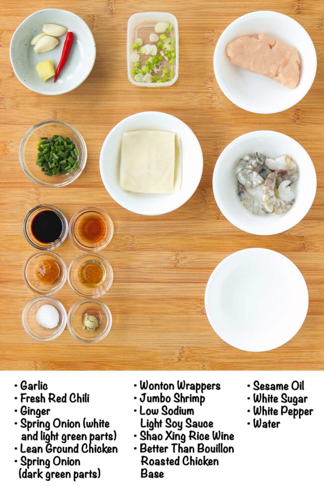 Labeled ingredients for Viral Dumpling Lasagna on a wood board.