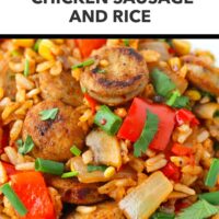 Front view of plate with seared chicken sausage, rice and veggies dish. Text overlay "Easy Weeknight Dinner!" and "Chicken Sausage and Rice".