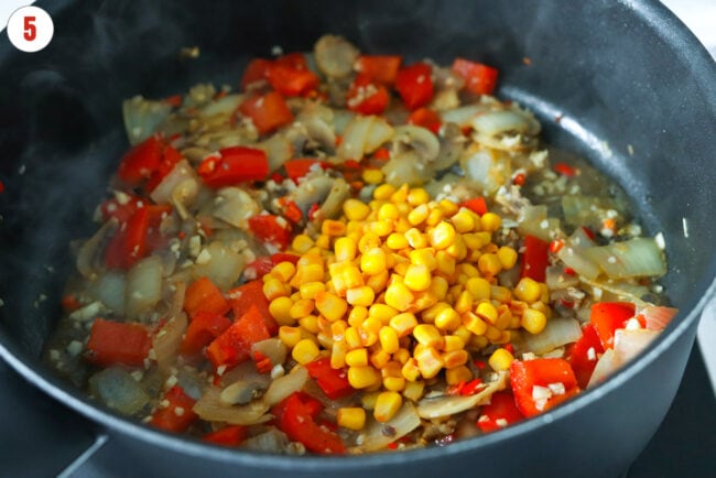 Added canned corn to skillet with sautéed veggies.