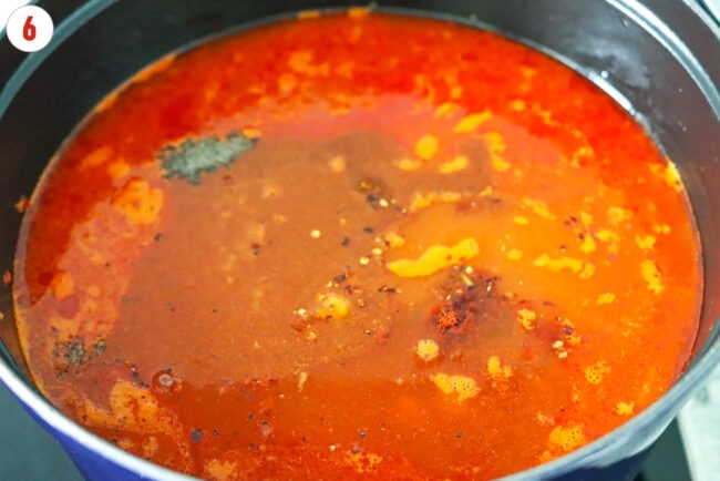 Seasonings added to pot with spicy tomato soup.