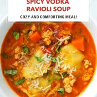 Bowl with spicy ravioli soup with chicken topped with grated parmesan and sliced basil. Text overlay "Spicy Vodka Ravioli Soup" and "Cozy and Comforting Meal!".