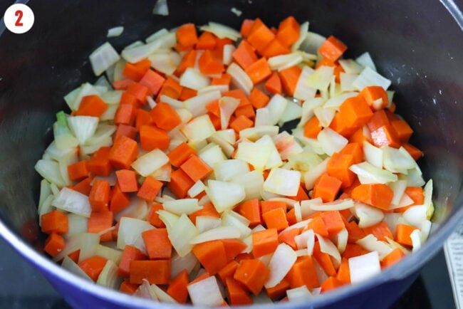 Sautéed diced onion and carrots in large Dutch oven.