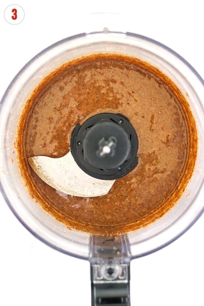 Homemade pecan butter in a food processor bowl.
