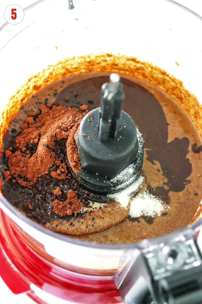 Added cocoa powder, melted dark chocolate and salt to pecan butter in a food processor bowl.