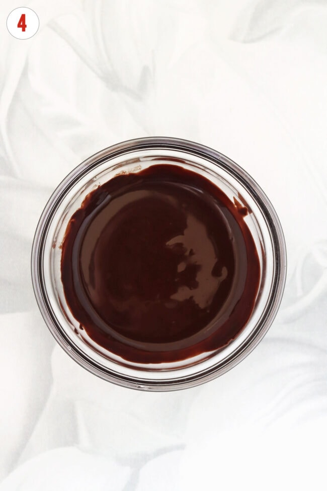 Melted dark chocolate in a bowl.