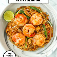 Plate with Thai rice noodles stir-fry with shrimp. Text overlay "Pad Mee Korat with Shrimp", "Pad Thai's Spicier Cousin!" and "That Spicy Chick".