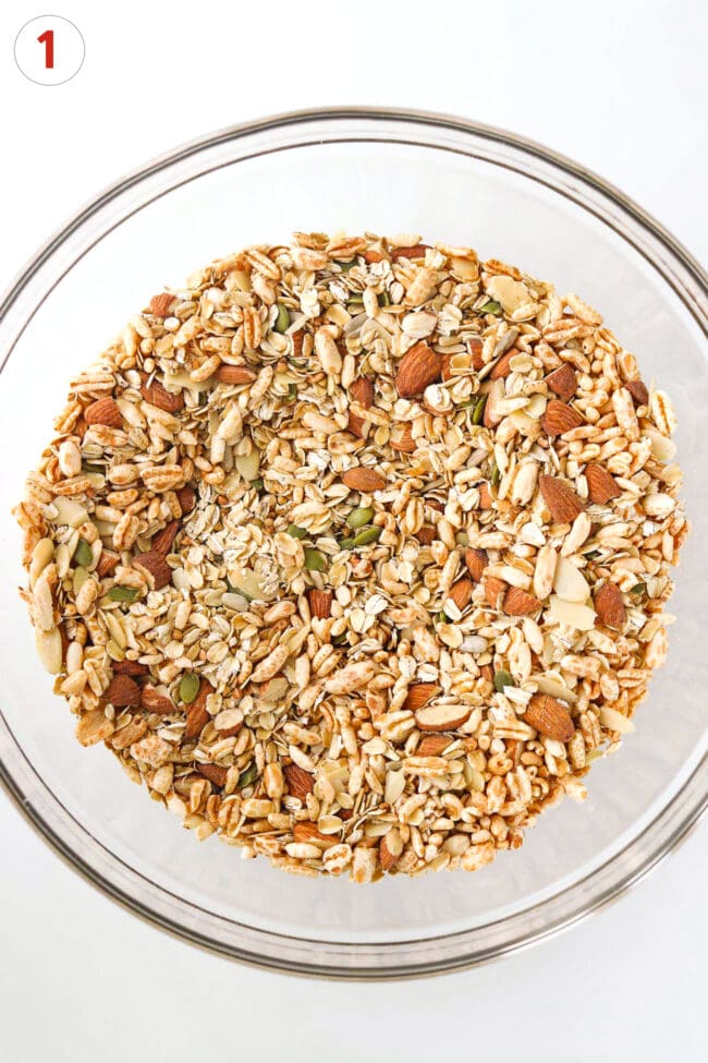 Dry ingredients for almond granola in a large mixing bowl.