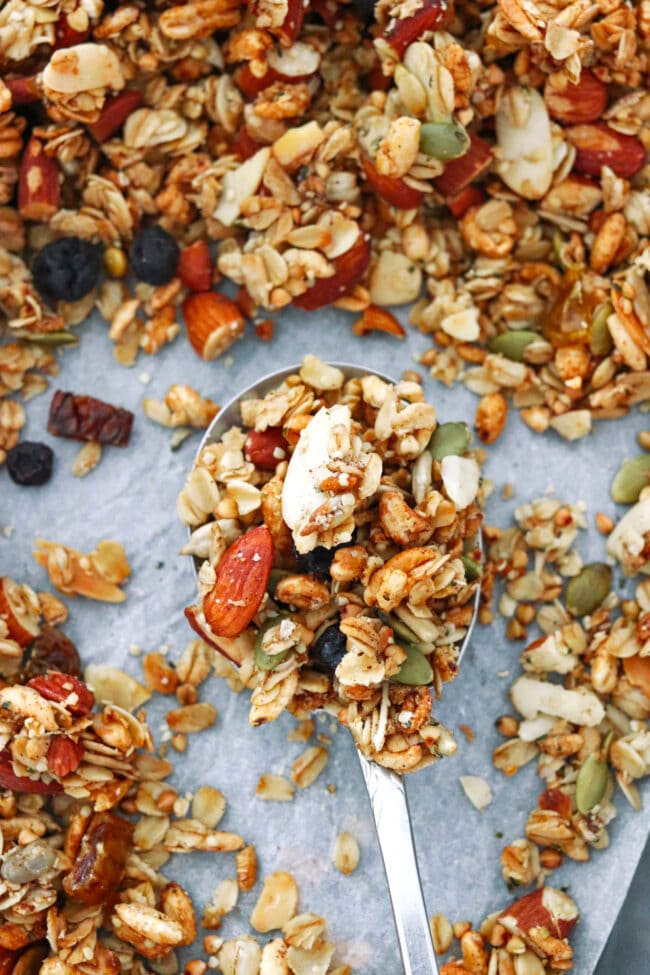 Spoon with vanilla almond granola closeup.