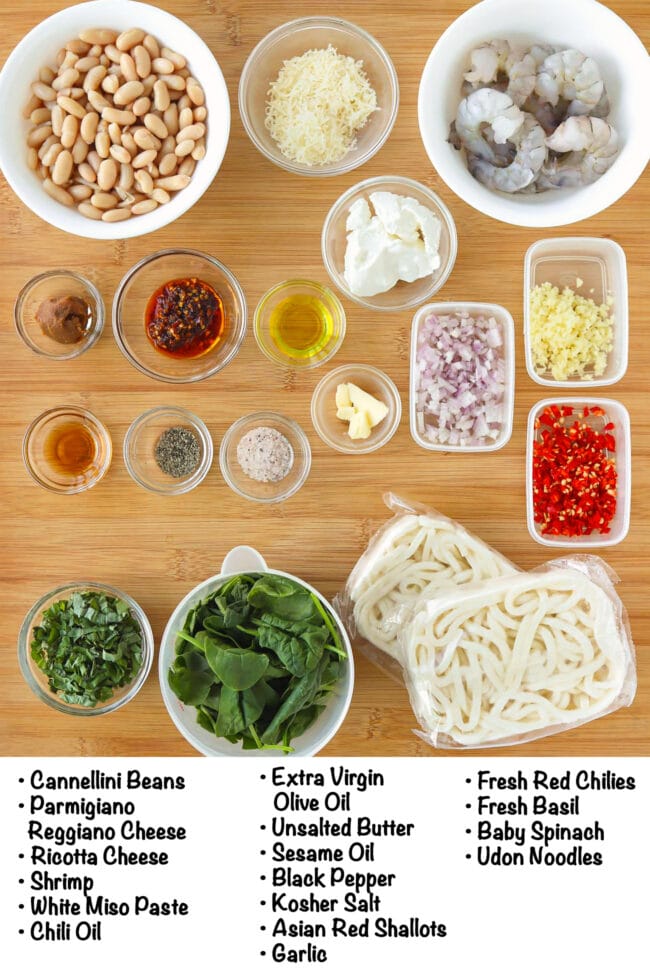 Labeled ingredients for Cannellini Bean Sauce for Pasta or Noodles on a wood board.