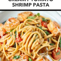 Plate with cream sauce shrimp pasta with cherry tomatoes, spinach, basil topped with grated parmesan. Text overlay "Easy Weeknight Dinner!", "Creamy Tomato Shrimp Pasta", and "That Spicy Chick".