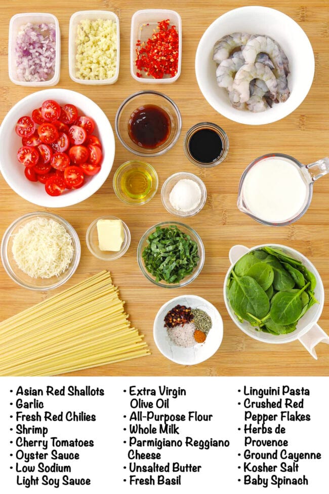 Labeled ingredients for creamy tomato shrimp pasta on a wood board.