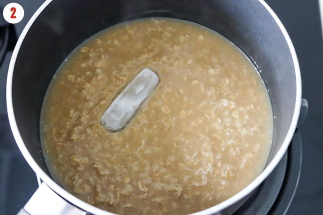 Ice cube added to pot with creamy oats cooked in bone broth.