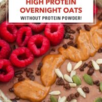 Closeup of bowl of chocolate overnight oats with raspberries, seeds, cacao nibs and peanut butter. Text overlay "High Protein Overnight Oats without Protein Powder!" and "That Spicy Chick".