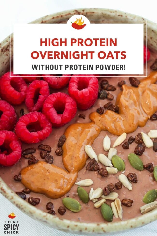 Closeup of bowl of chocolate overnight oats with raspberries, seeds, cacao nibs and peanut butter. Text overlay "High Protein Overnight Oats without Protein Powder!" and "That Spicy Chick".