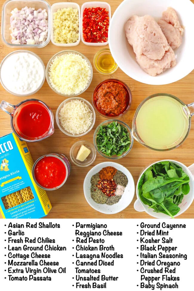 Labeled ingredients for Red Pesto Chicken Lasagna Skillet on a wood board.