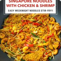 Wok with curry rice vermicelli noodles with chicken, shrimp and vegetables. Text overlay "Singapore Noodles with Chicken & Shrimp", "Easy Weeknight Noodles Stir-fry!!" and "That Spicy Chick".