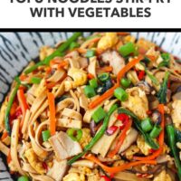Closeup front view of plate with noodles made from tofu and veggies stir-fry. Text overlay "High Protein | Low Carb" and "Tofu Noodles Stir-fry with Vegetables".
