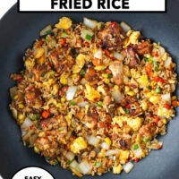 Air fryer tofu fried rice with scrambled eggs and vegetables in a wok. Text overlay "Air Fryer Tofu Fried Rice", "Easy", "Better Than Takeout!" and "That Spicy Chick".