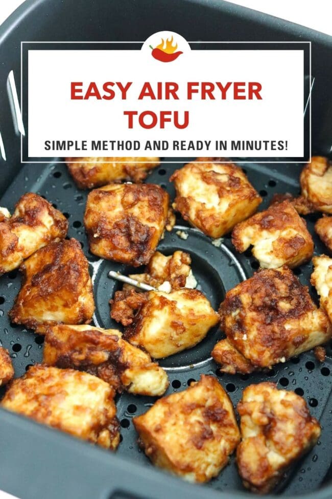 Closeup of air fryer tofu chunks in an air fryer basket. Text overlay "Easy Air Fryer Tofu" and "Simple Method and Ready in Minutes!".