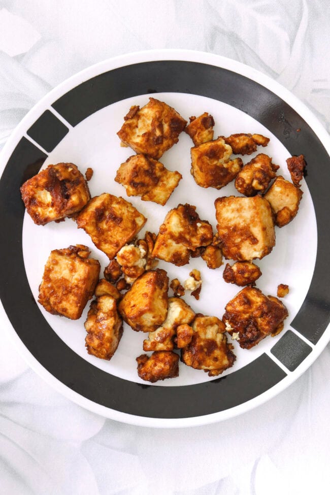 Plate with crispy air fryer tofu chunks.
