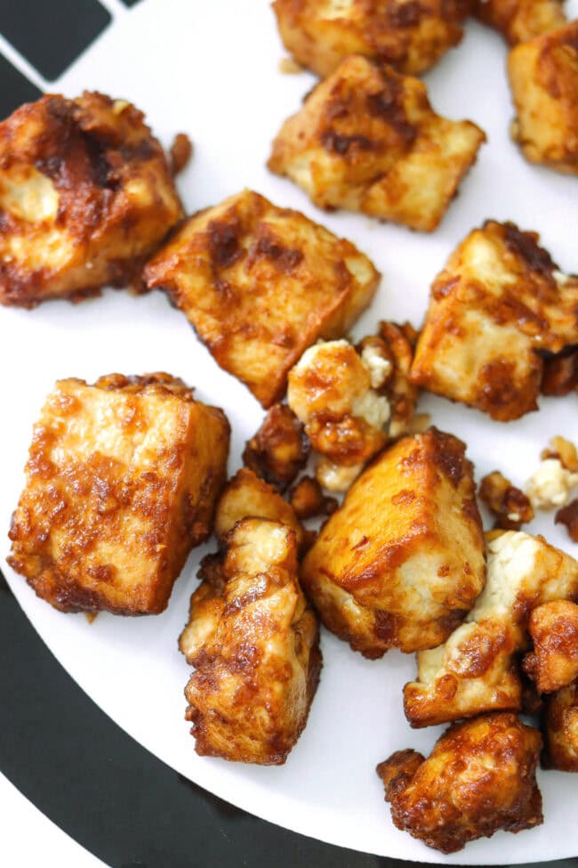 Closeup of crispy air fryer tofu nuggets on a plate.